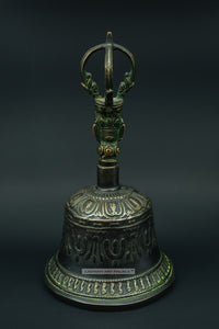 Old brass bell with Buddha face - the ladakh art palace