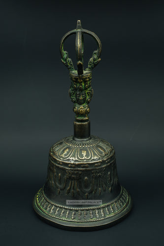 Old brass bell with Buddha face - the ladakh art palace